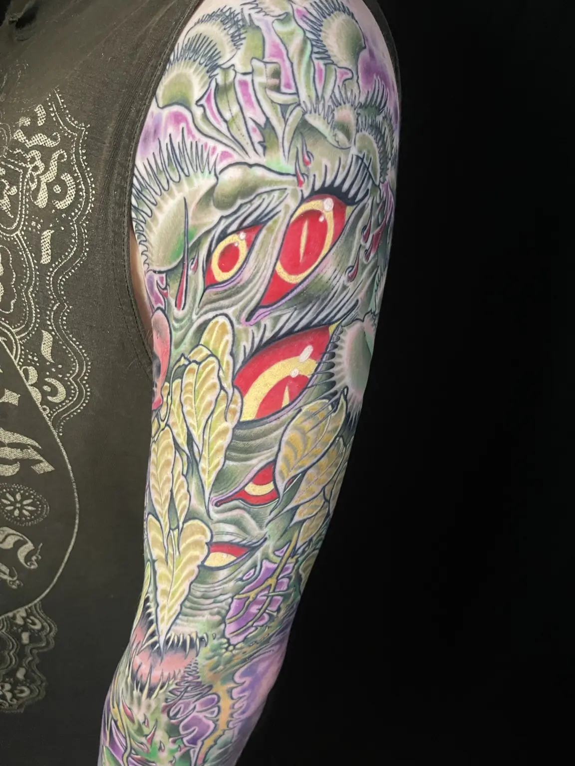 Large full-color Japanese-inspired creature sleeve tattoo by Keith